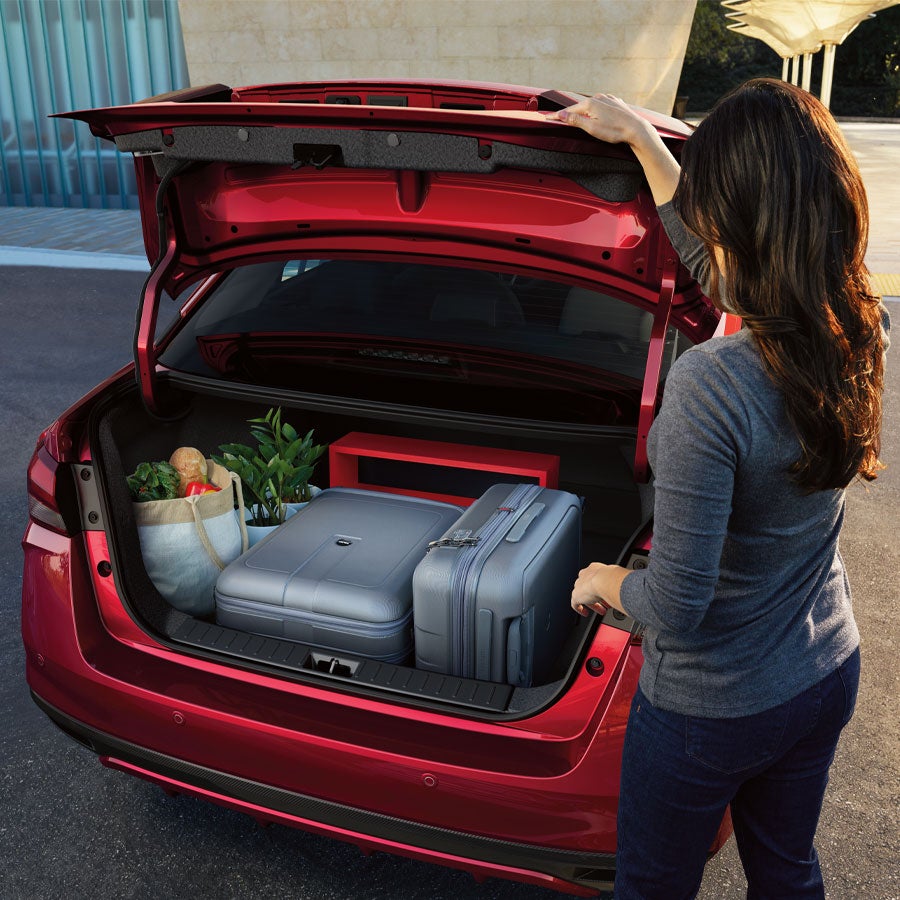 2025 Nissan Versa rear view of open trunk with luggage and groceries inside